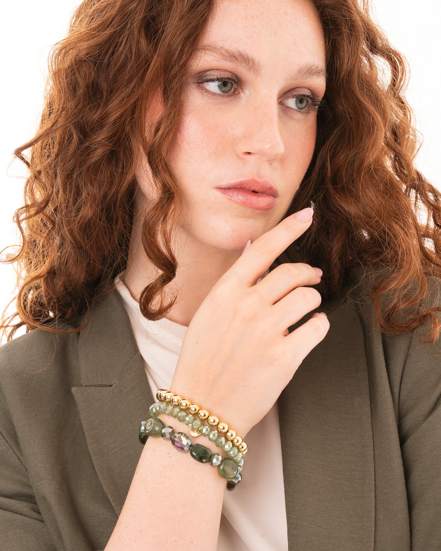 Bracciale elastico multi filo con pietre in acrilico e vetro tono verde