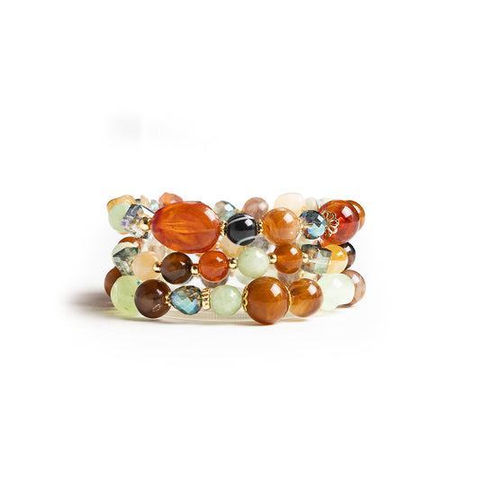 Bracciale elastico a tre linee con pietre in acrilico e vetro multi arancio