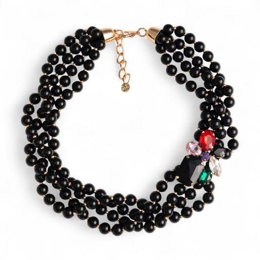 Collana girocollo multifilo con sfere in acrilico nere e fiore con pietre in vetro multicolore