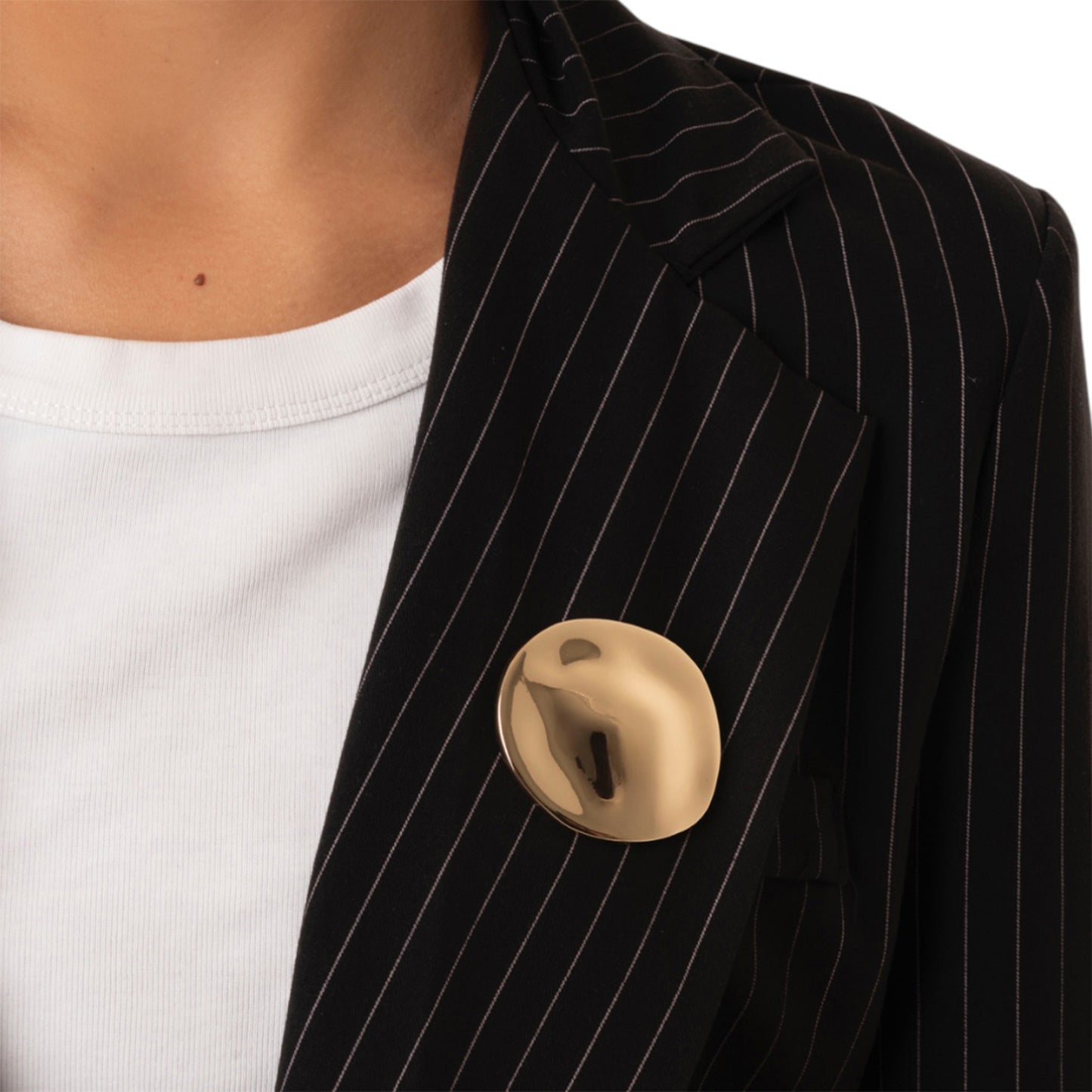 Spilla in metallo lucido dal design circolare schiacciato