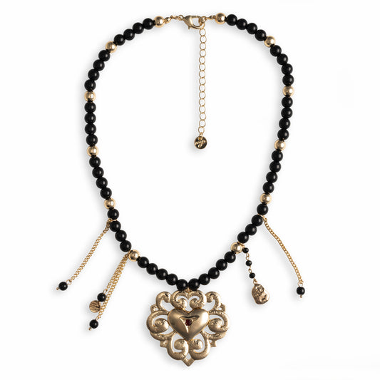 Collana girocollo con pietre in acrilico nere, pendente in metallo con design cuore sacro