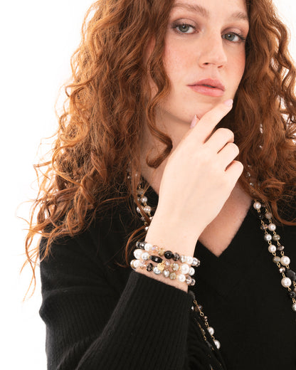 Bracciale elastico a tre fili con pietre in vetro tono grigio