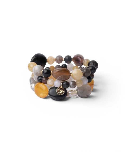 Bracciale elastico a tre fili con pietre in acrilico tono grigio e giallo