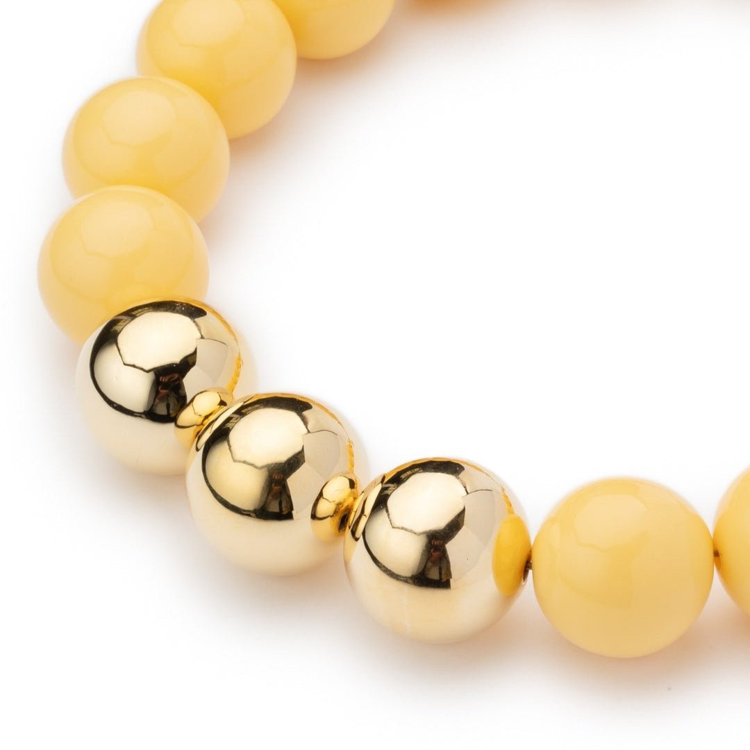 Collana girocollo in acrilico con sfere gialle di cui tre placcate in oro - Mya Accessories