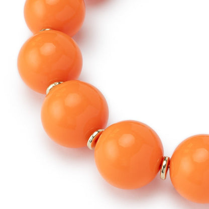 Collana girocollo in acrilico XXL arancio con rondelle in ottone - Mya Accessories