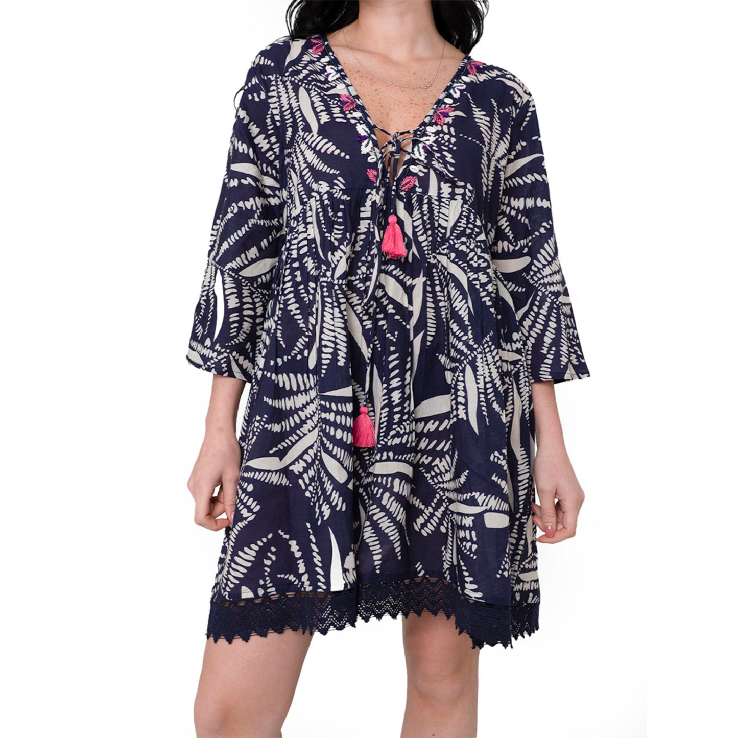 Vestito corto in cotone fondo blu con stampa foglie tropicali