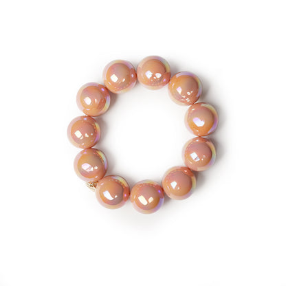Bracciale elastico con sfere lucide in acrilico rosa