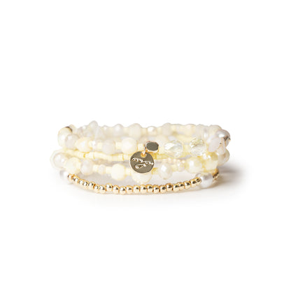 Bracciale elastico multi filo con pietre in vetro e conchiglie gialle