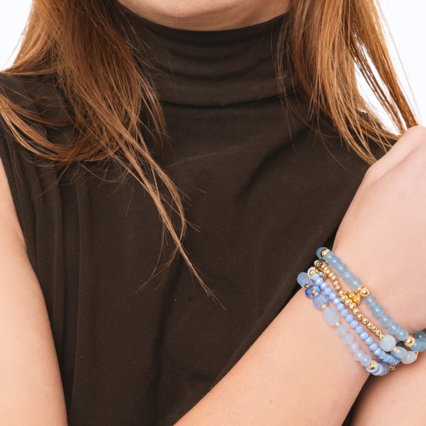 Bracciale elastico multi filo con pietre dure tono celeste