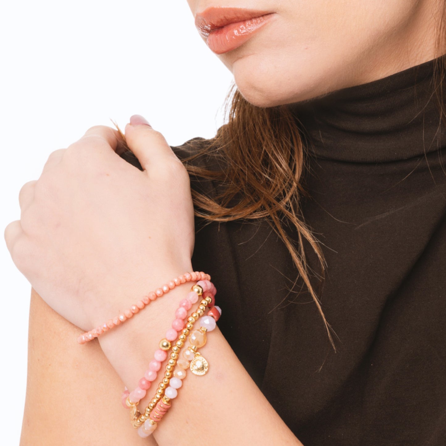 Bracciale elastico multi filo con pietre dure tono rosa