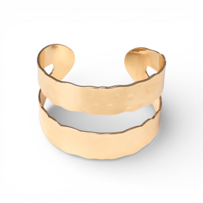 Bracciale rigido a fascia in metallo con bordo dentellato