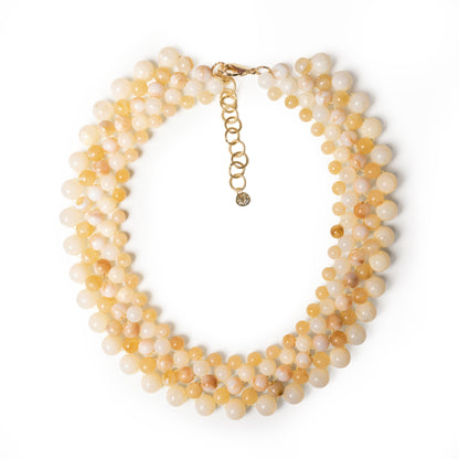 Collana girocollo con sfere in acrilico intrecciate beige