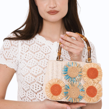 Borsa beige con manico e fiori a rilievo