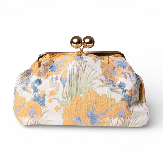 Borsa clutch morbida con motivo floreale arancio e celeste