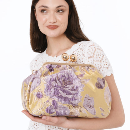 Borsa clutch morbida con motivo floreale viola ed oro
