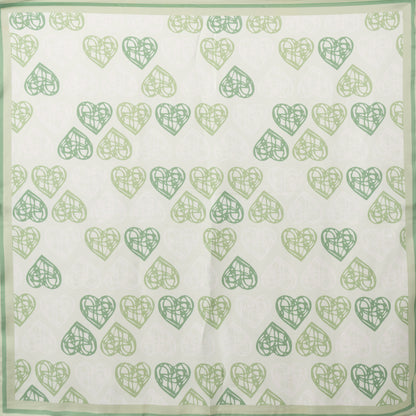 Foulard in seta con stampa a cuori tono verde